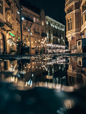 Artistic shot of a historic city street with warm lighting and detailed facades