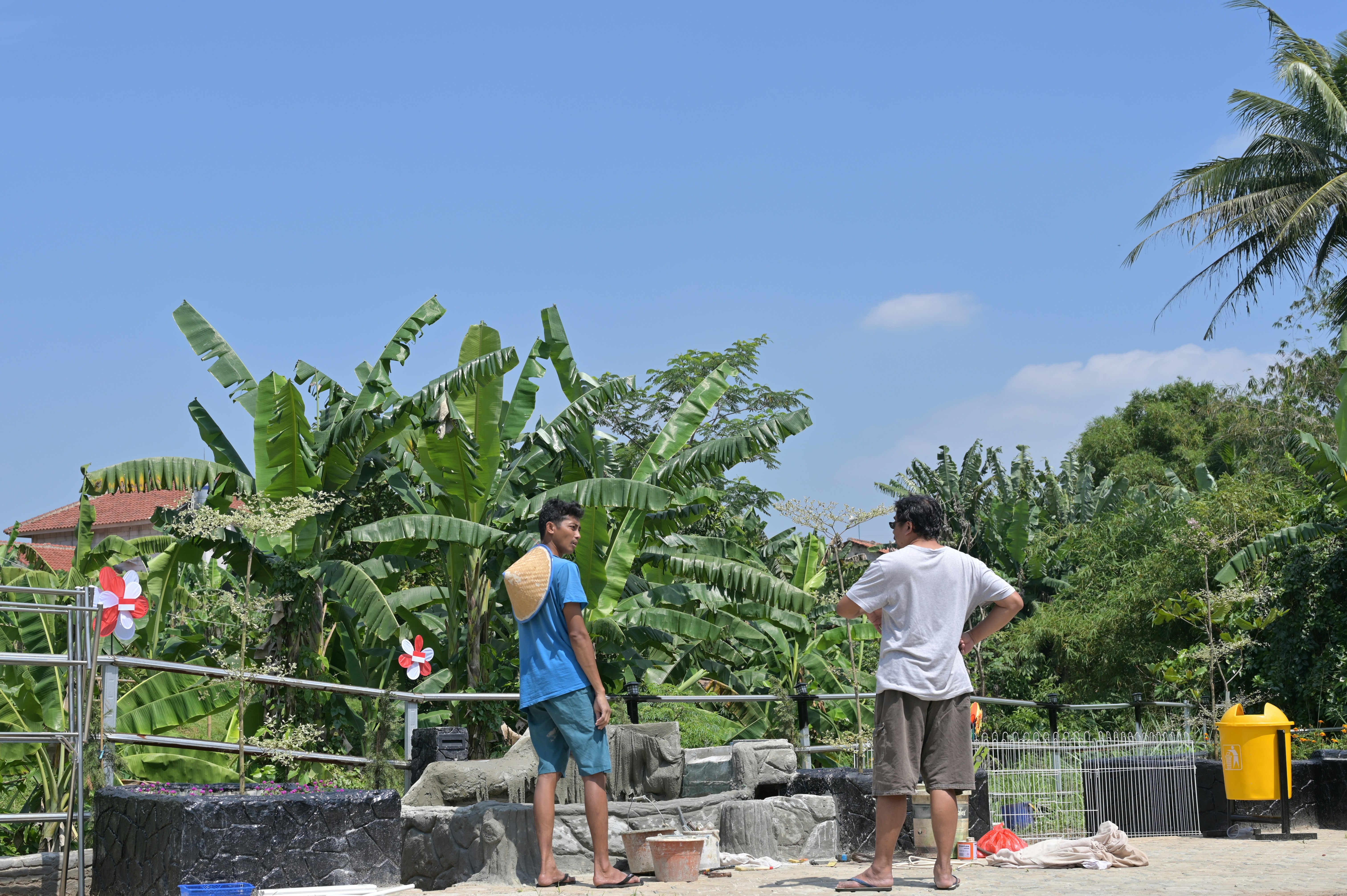 a couple of men standing next to each other