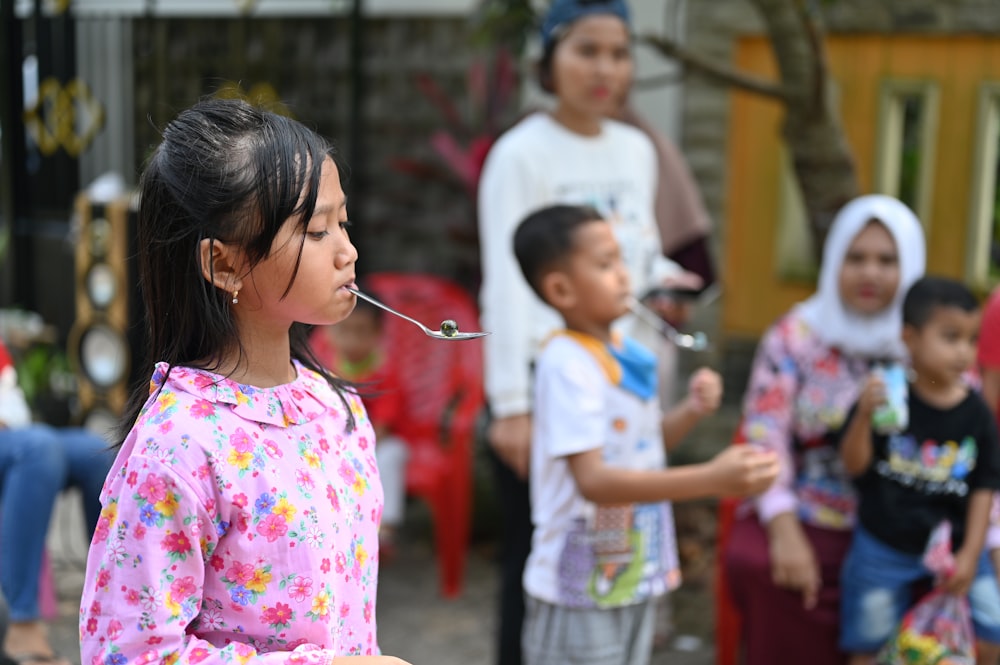 a group of children standing next to each other