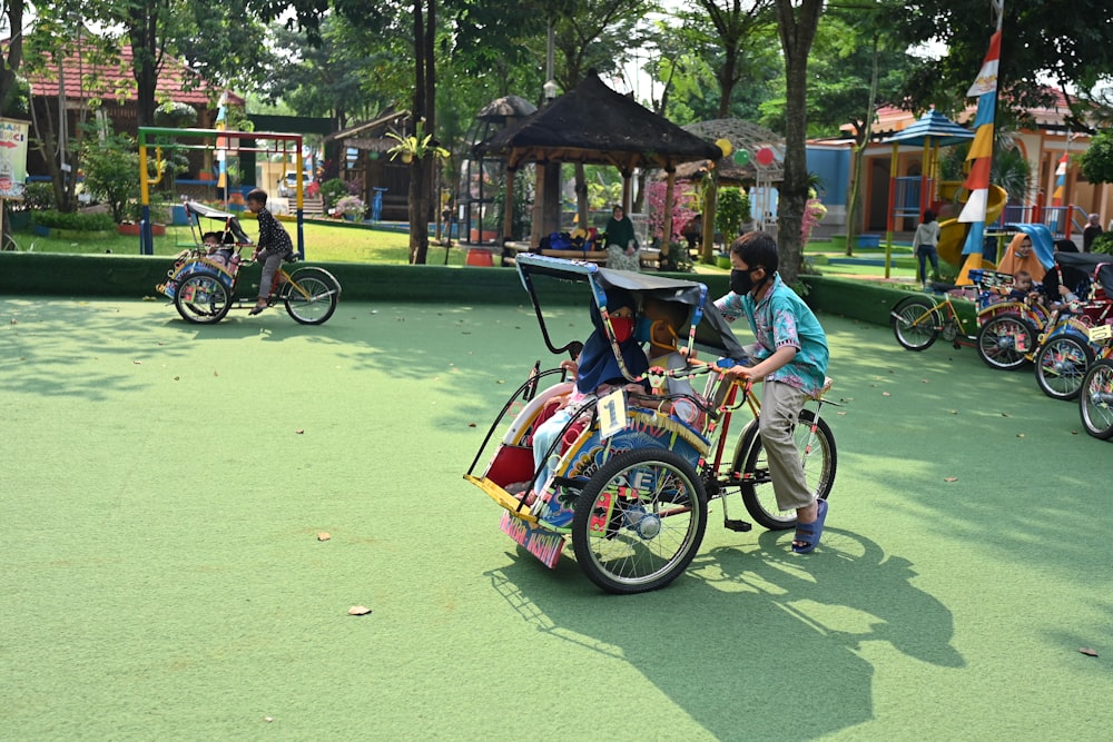 a group of people riding bikes on a playground