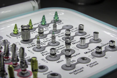 A set of orthopedic implants and tools arranged neatly on a white background.