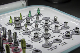 Close-up of titanium plates and screws used in maxillofacial reconstruction.