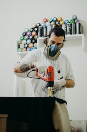 Close-up of a technician using Rotobrush equipment inside a home air duct in Santo Domingo