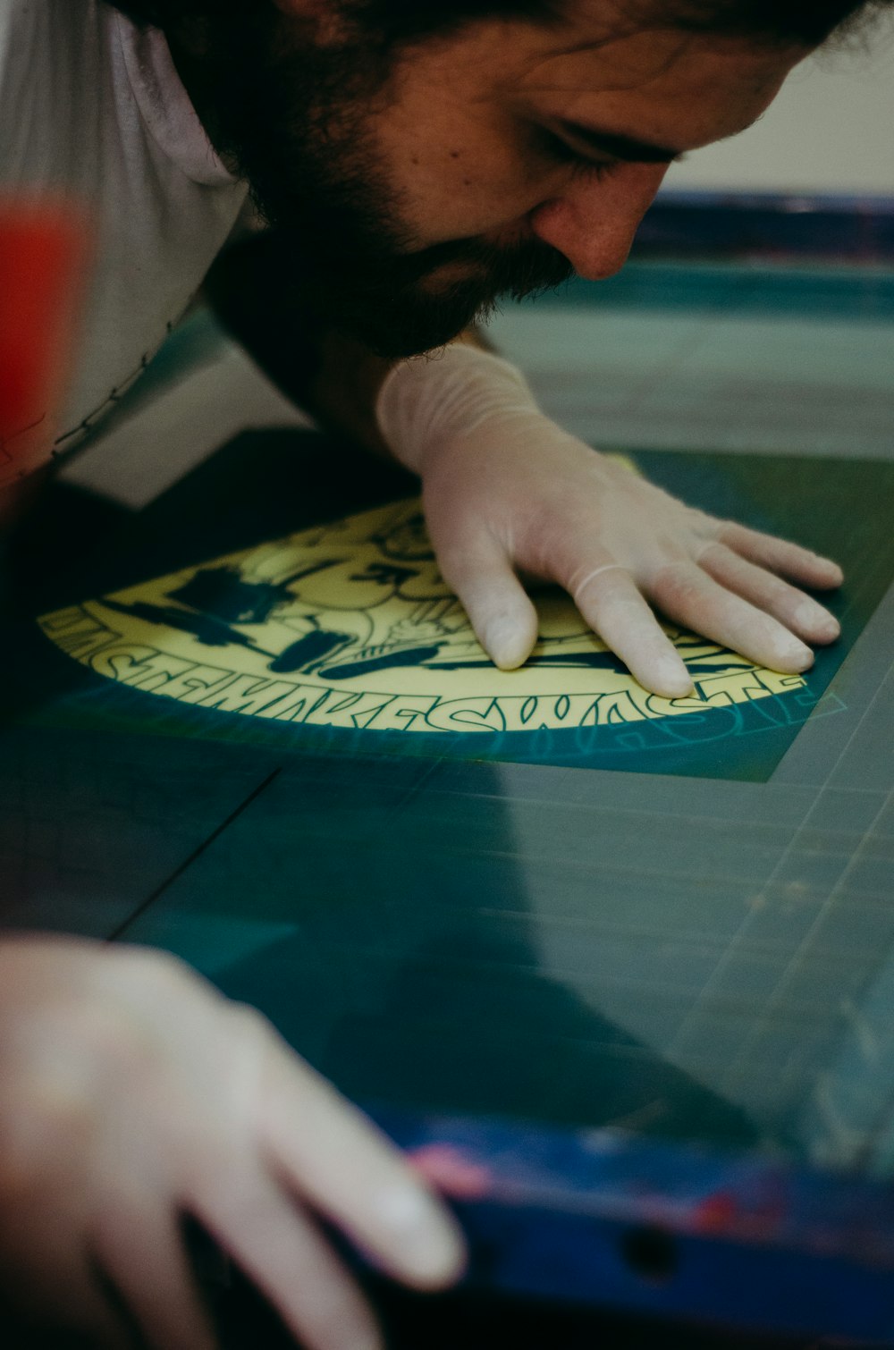 a close up of a person touching a piece of paper