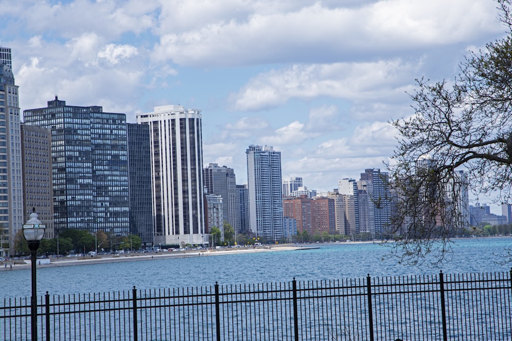 a large body of water next to tall buildings