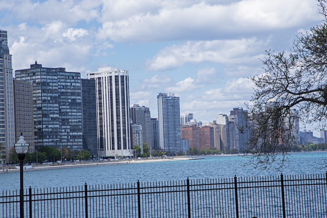 a large body of water next to tall buildings,