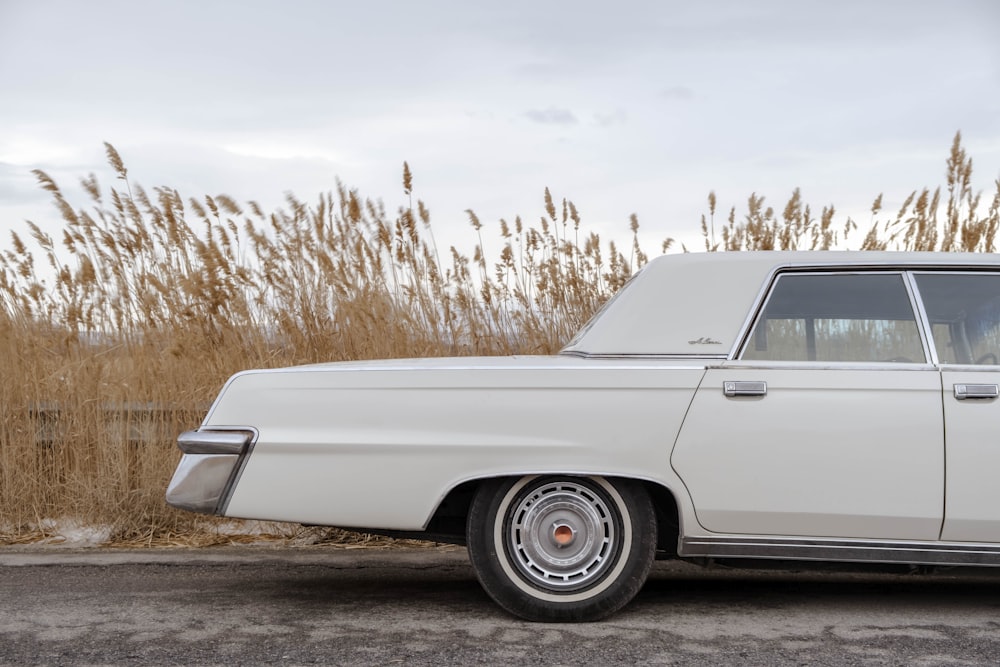 a white car parked on the side of the road