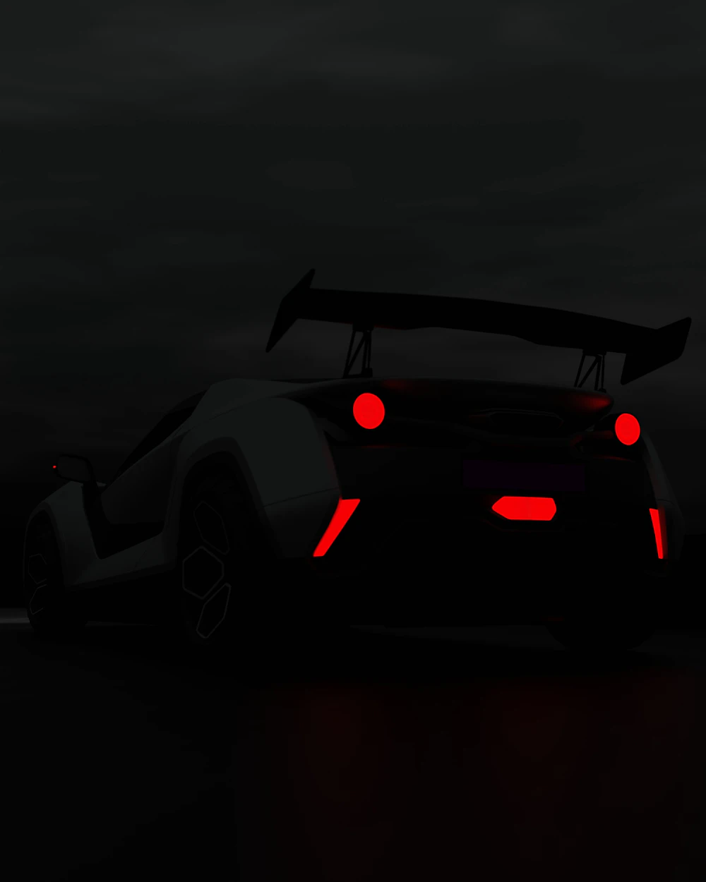 Dark car on the road at night