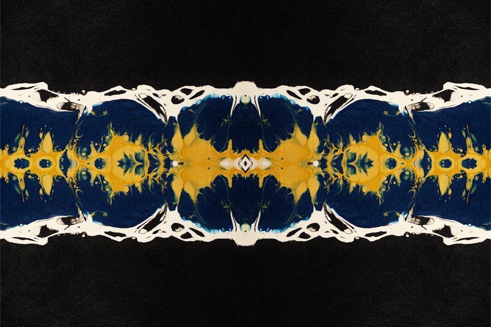 a black background with a yellow and blue pattern