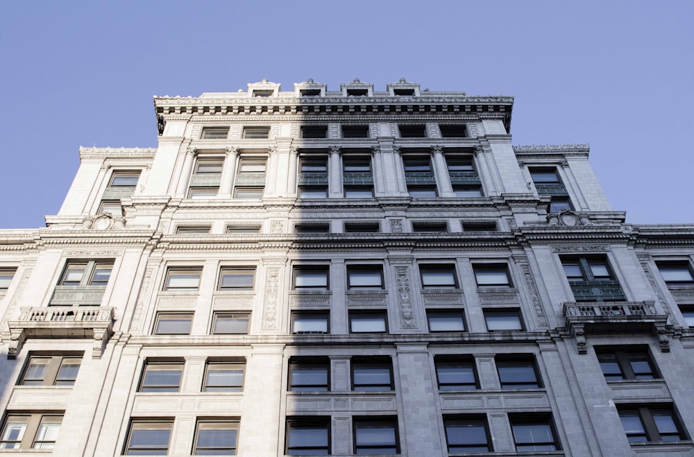 a tall building with a clock on the top of it