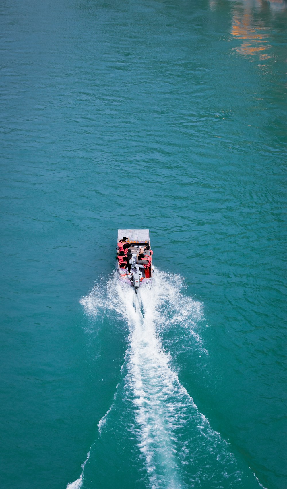 a small boat traveling across a body of water