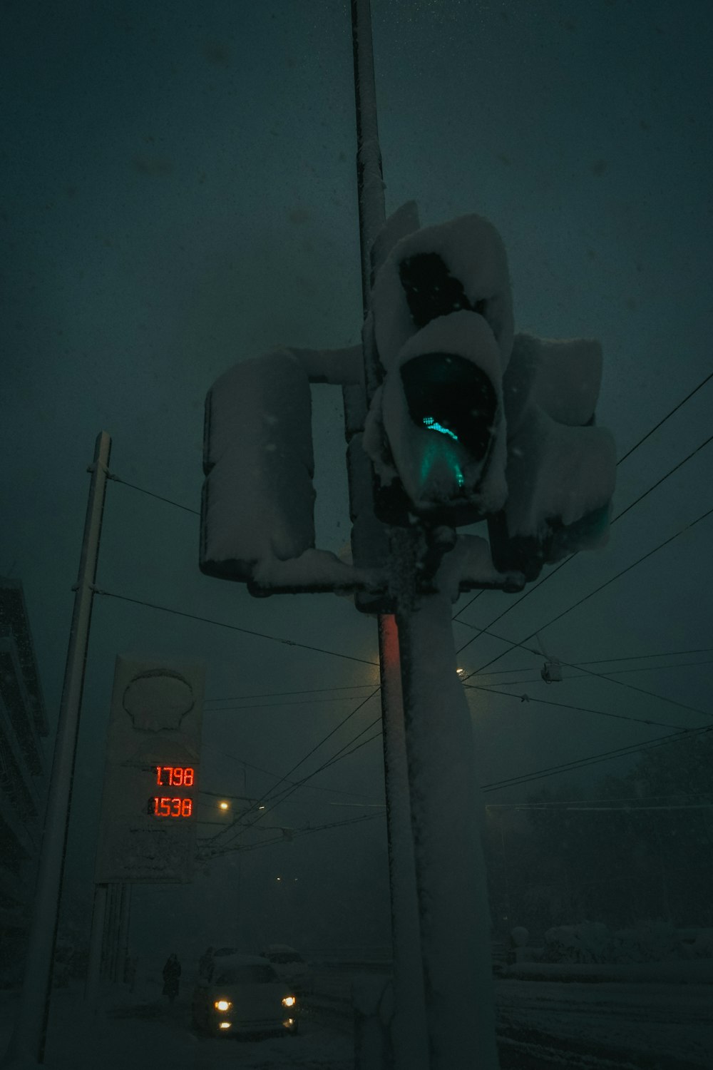 a traffic light that is covered in snow