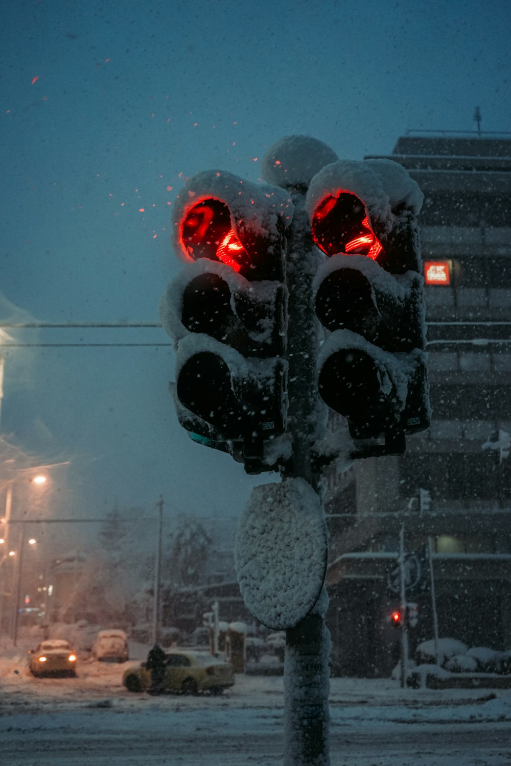 a traffic light that is covered in snow