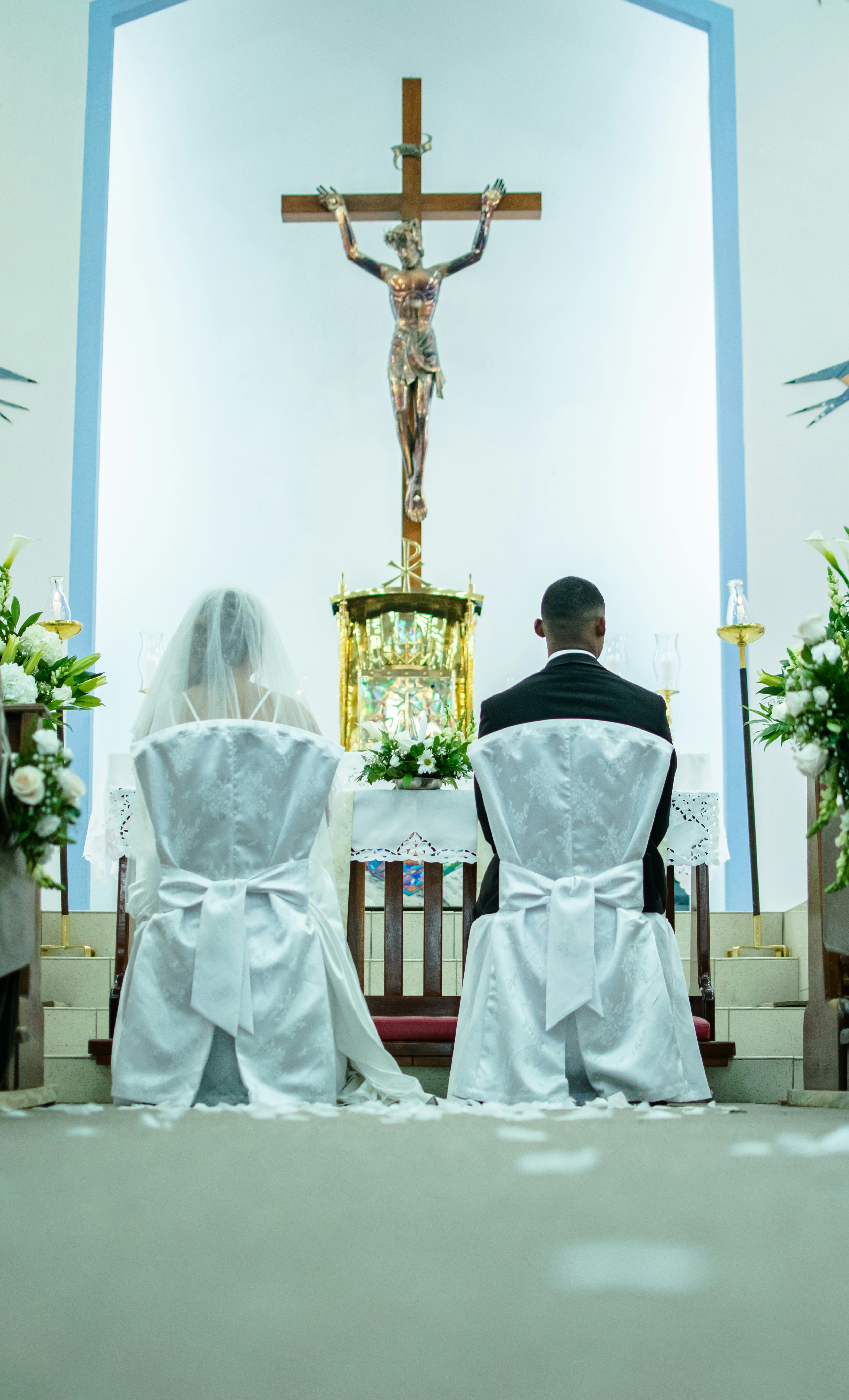 a man and a woman sitting in a church