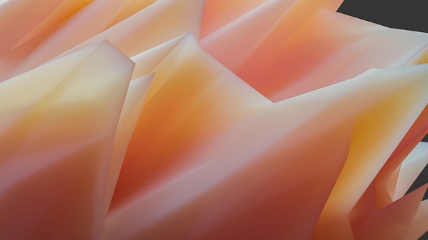 A collection of abstract geometric shapes with sharp edges and a smooth gradient of warm colors, primarily in shades of orange and yellow. The forms create a sense of movement and depth, resembling crumpled or folded paper.