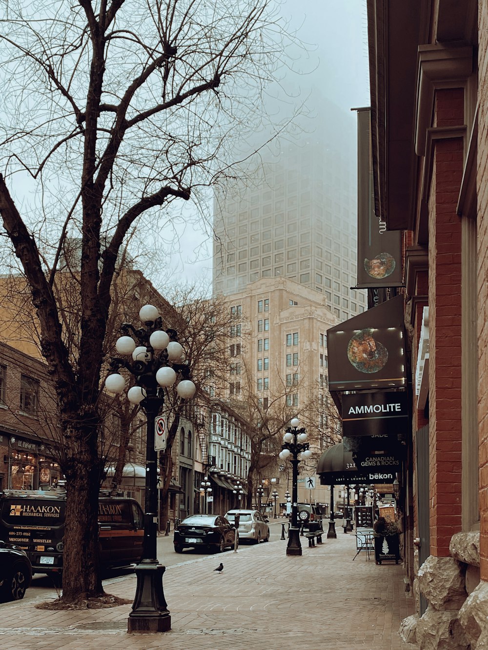 a city street with cars parked on the side of it