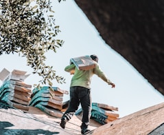 a man riding a skateboard on top of a roof