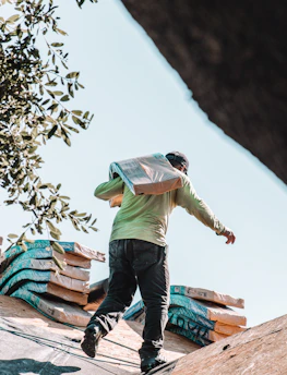a man riding a skateboard on top of a roof