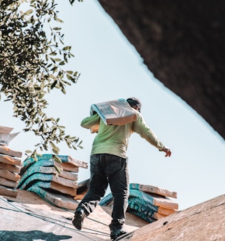 a man riding a skateboard on top of a roof