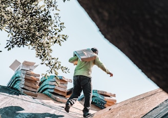 a man walking on top of a roof