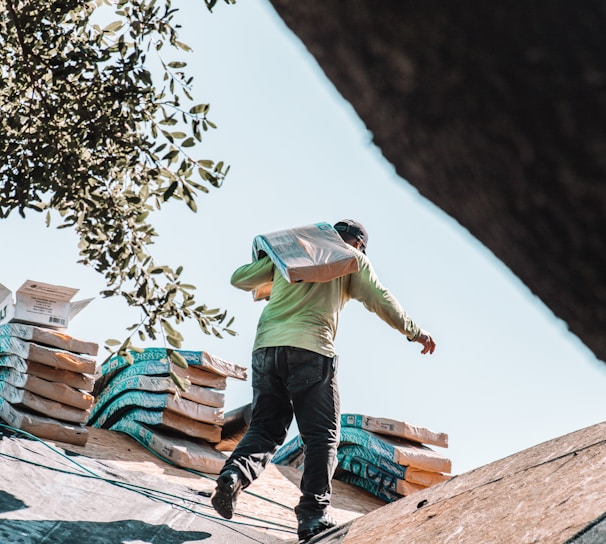 a man walking on top of a roof