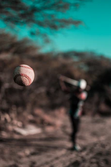 a baseball that is flying in the air