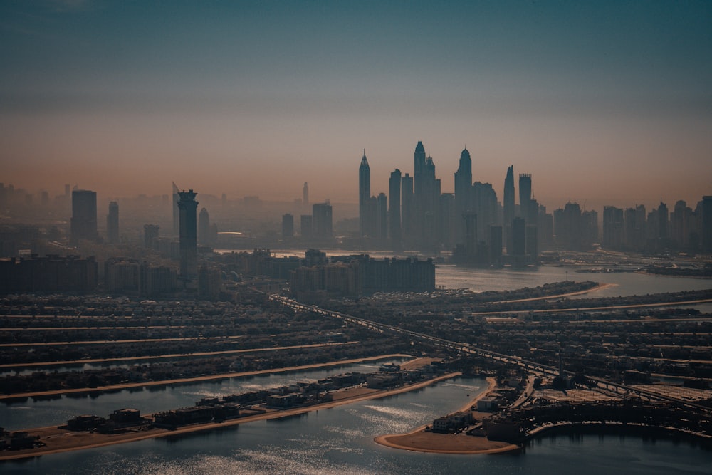 an aerial view of a city and a body of water