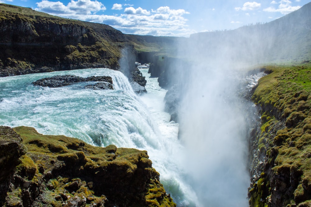 a large waterfall with water pouring out of it