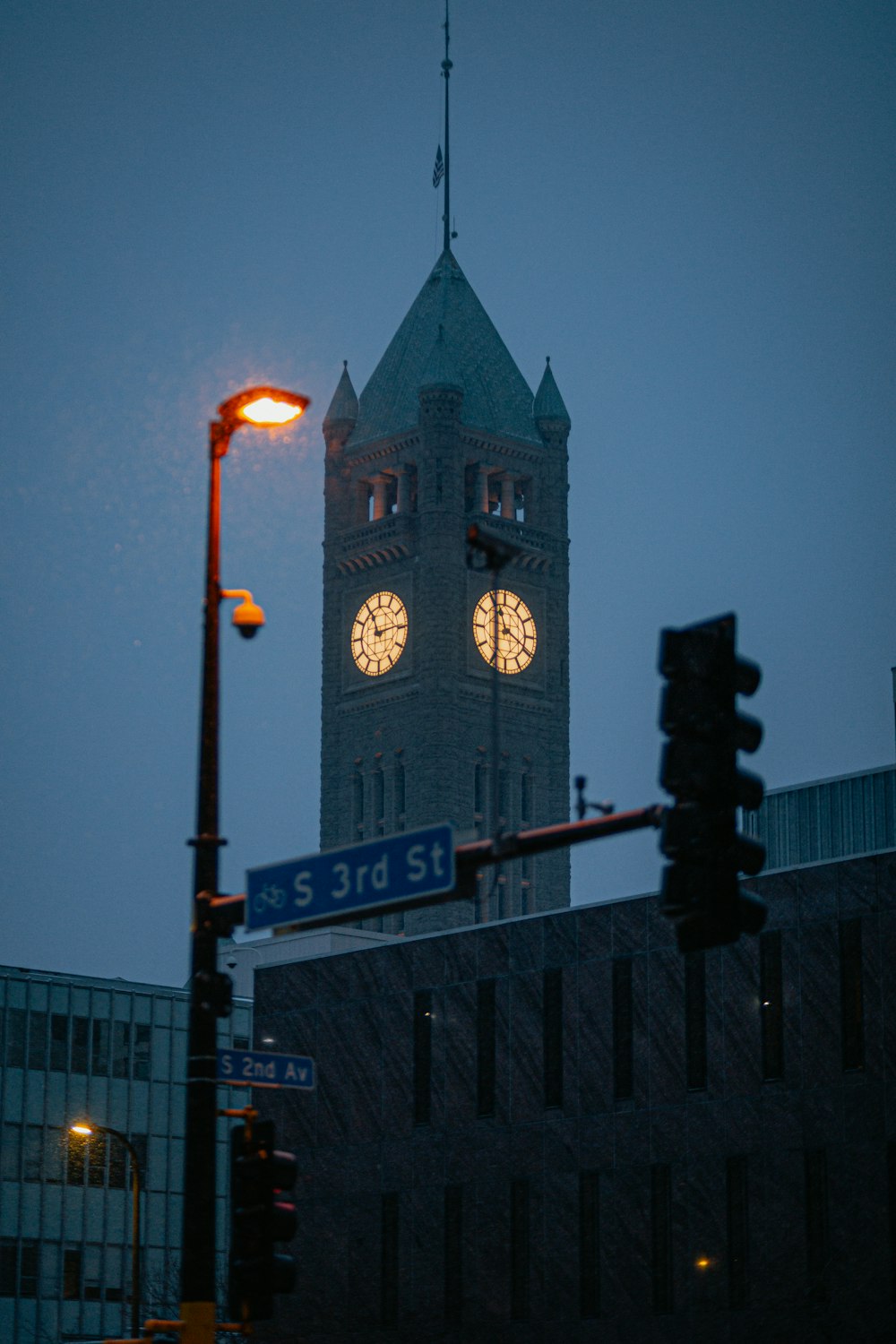 a tall clock tower towering over a city at night