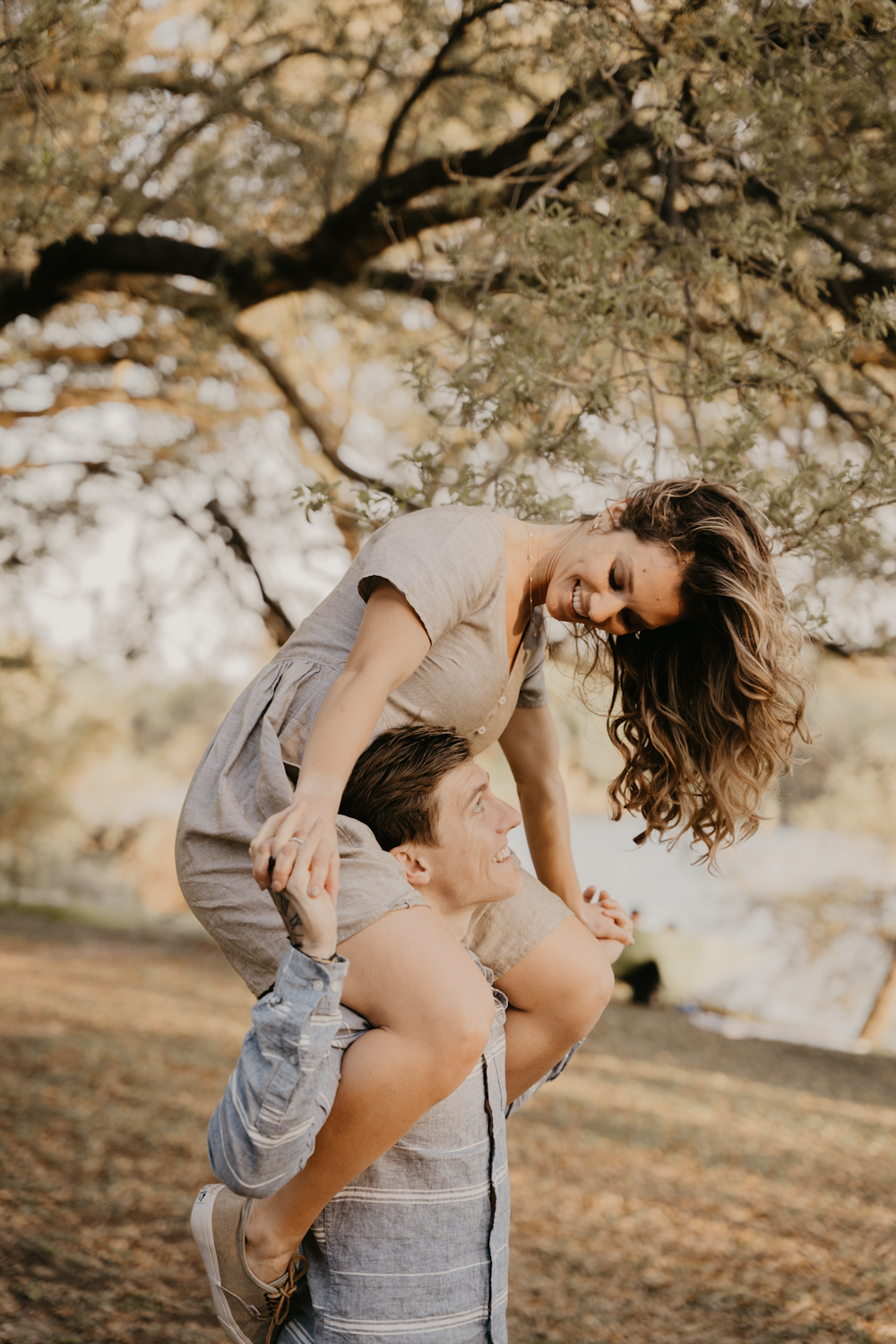 a man carrying a woman on his back