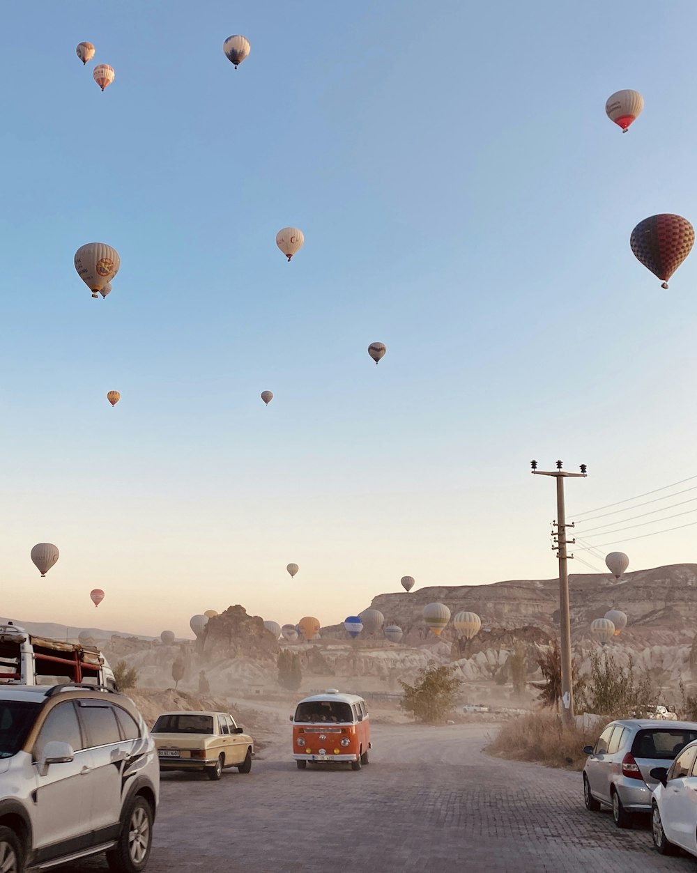 a bunch of hot air balloons flying in the sky