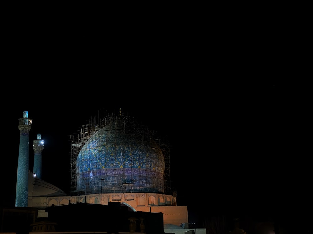 a large building with a blue dome in the middle of it