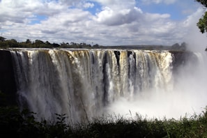 a large waterfall with water pouring out of it