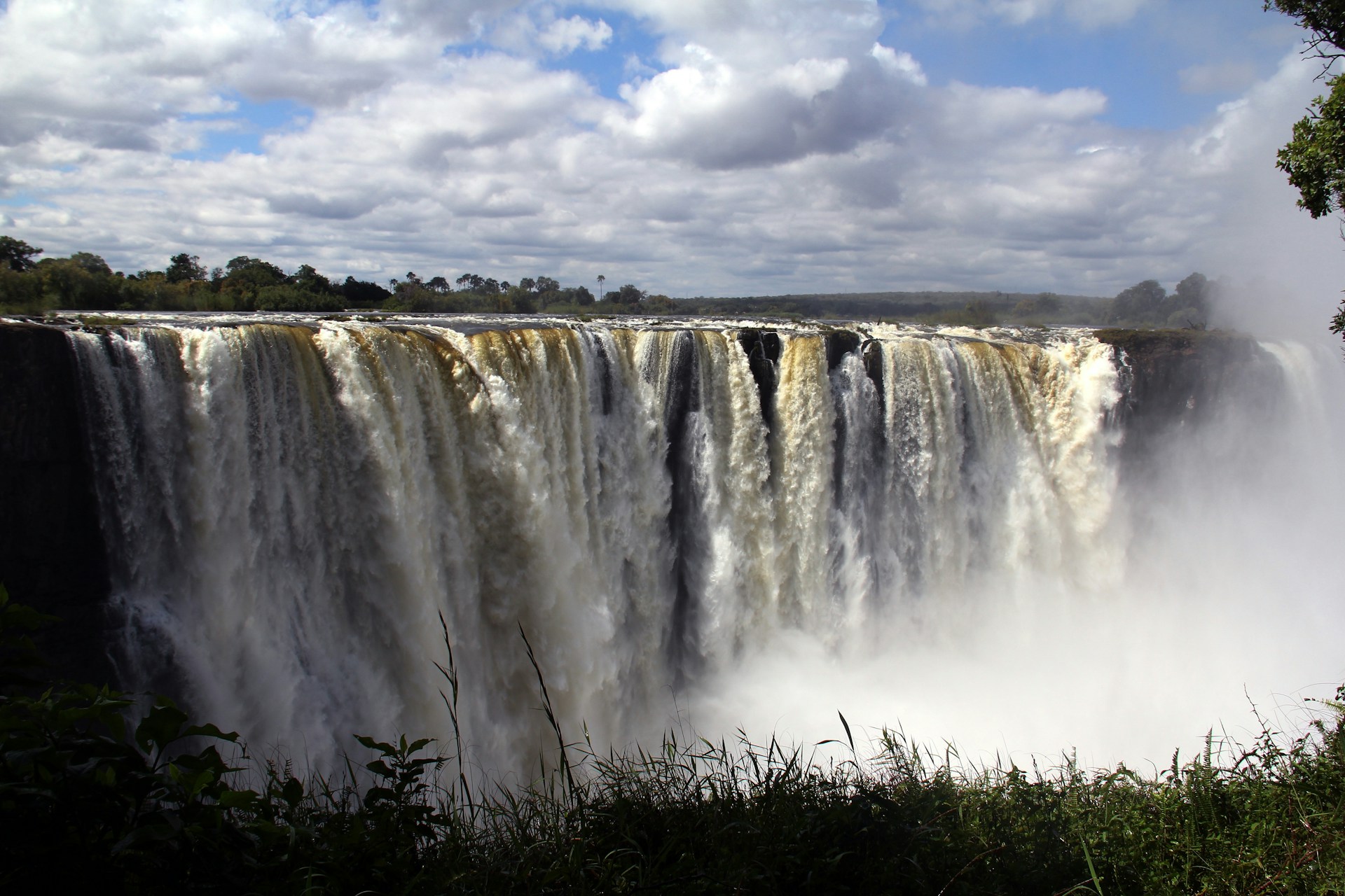 a large waterfall with water pouring out of it