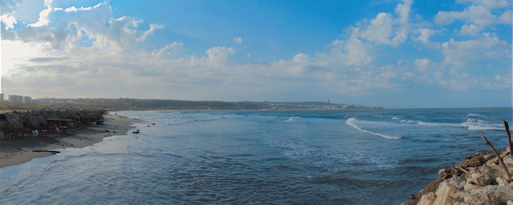 a body of water with waves coming in to shore