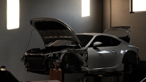 a car is being worked on in a garage