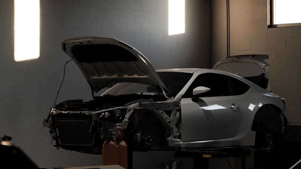 a car is being worked on in a garage