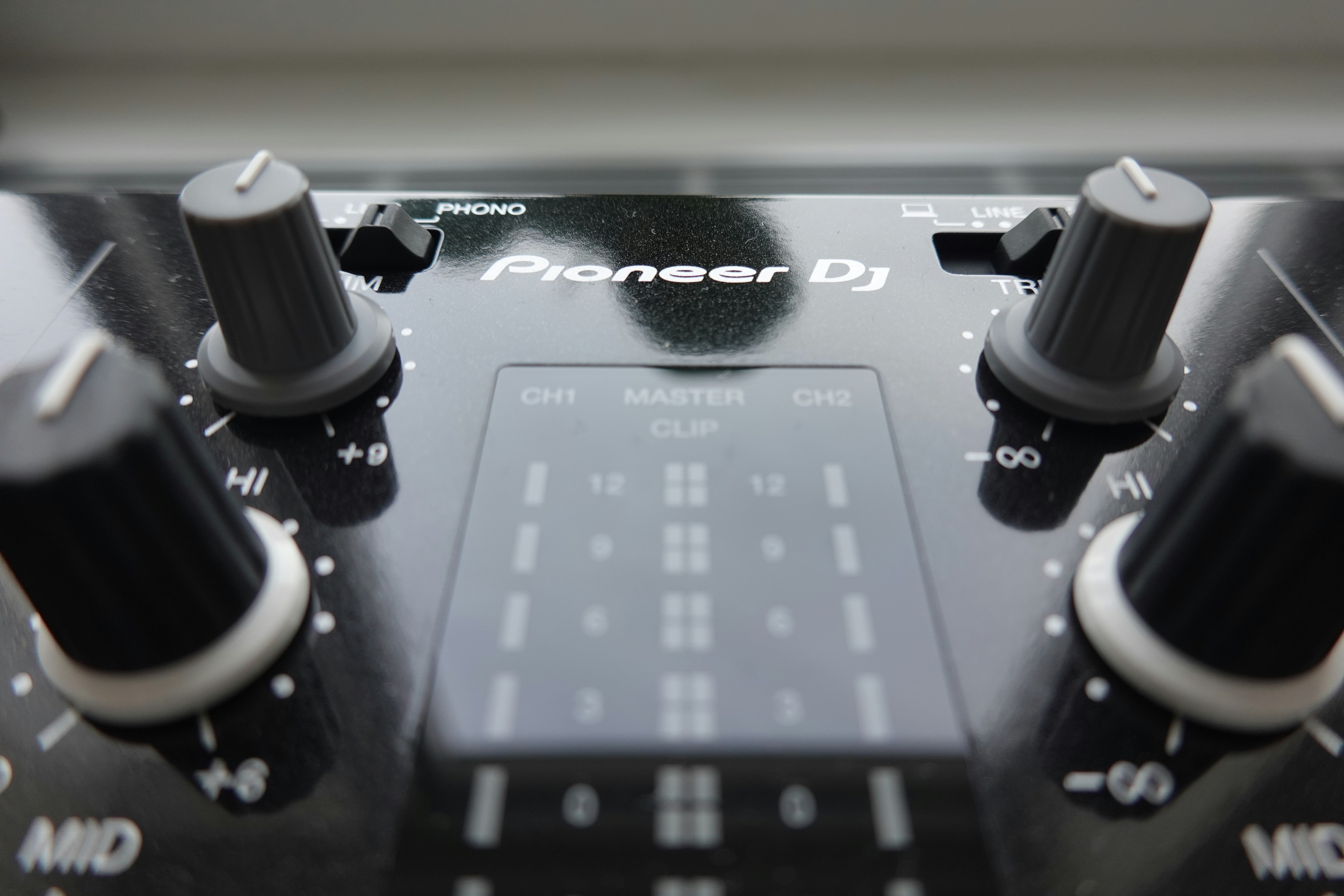 a close up of a sound board with knobs