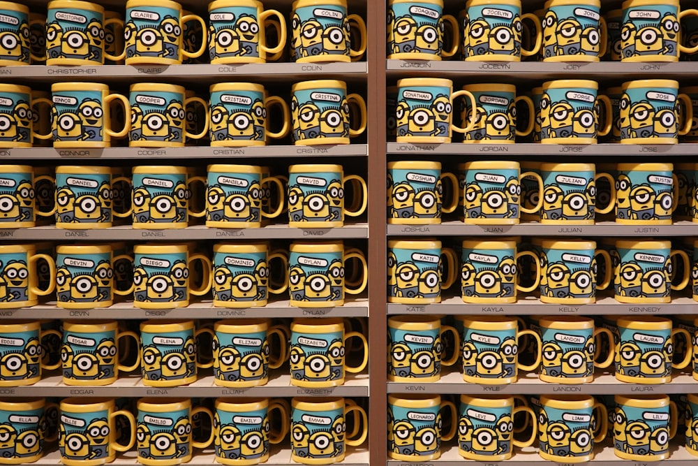 a shelf filled with lots of yellow and blue mugs