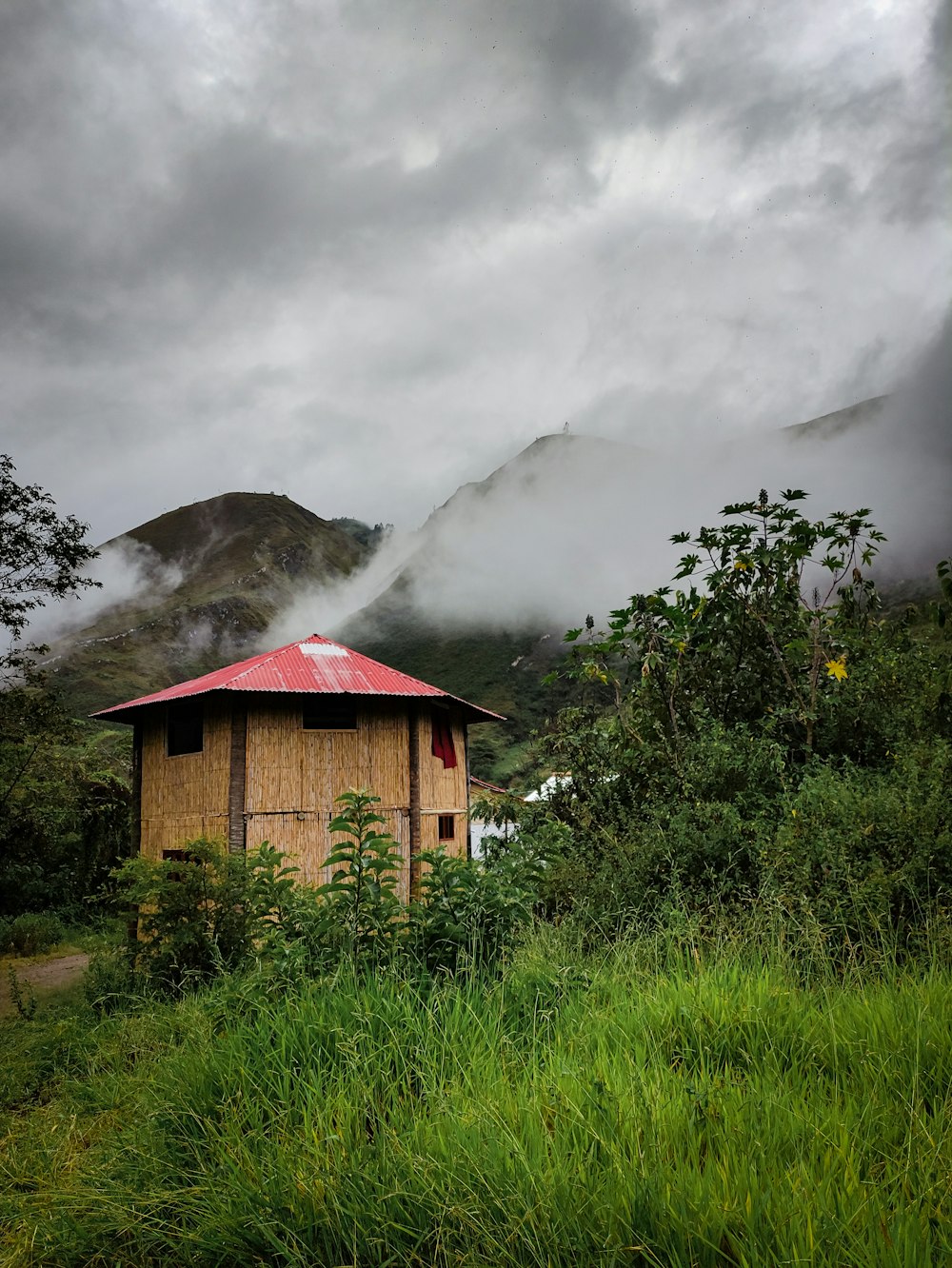 a small hut in the middle of a field