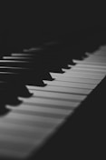 a black and white photo of a piano