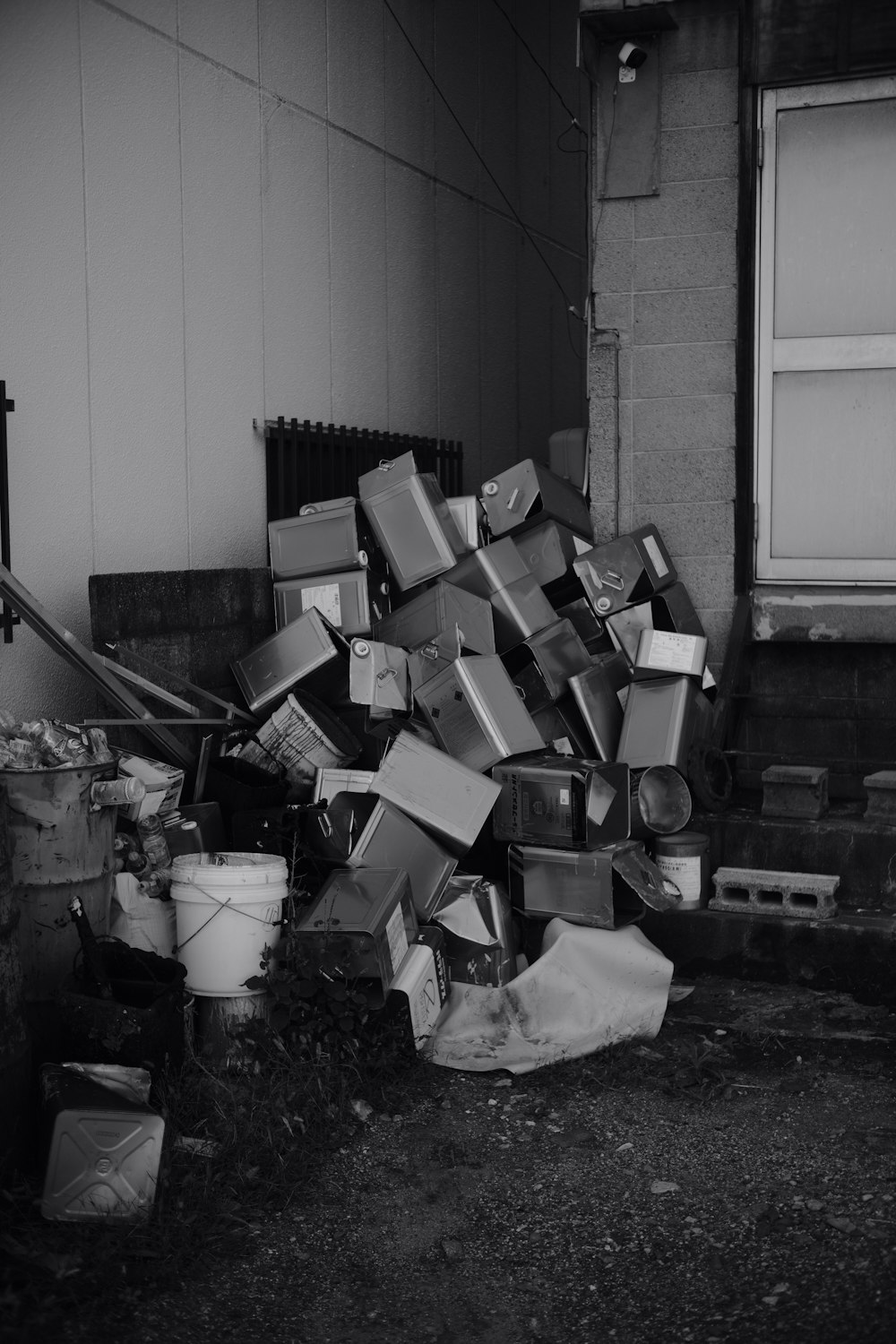 a pile of boxes sitting next to a building
