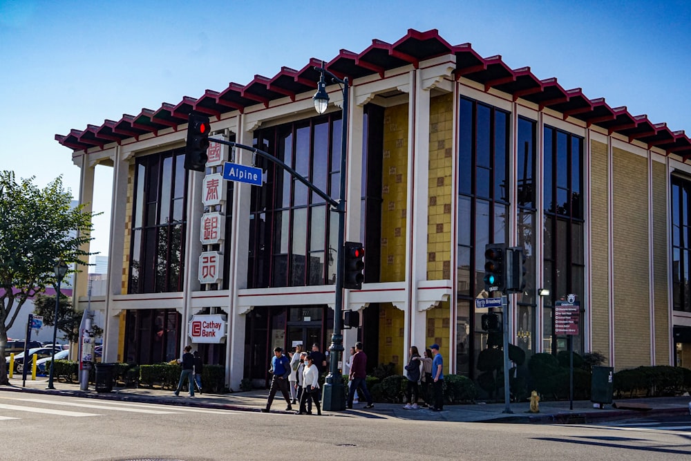 a group of people standing outside of a building