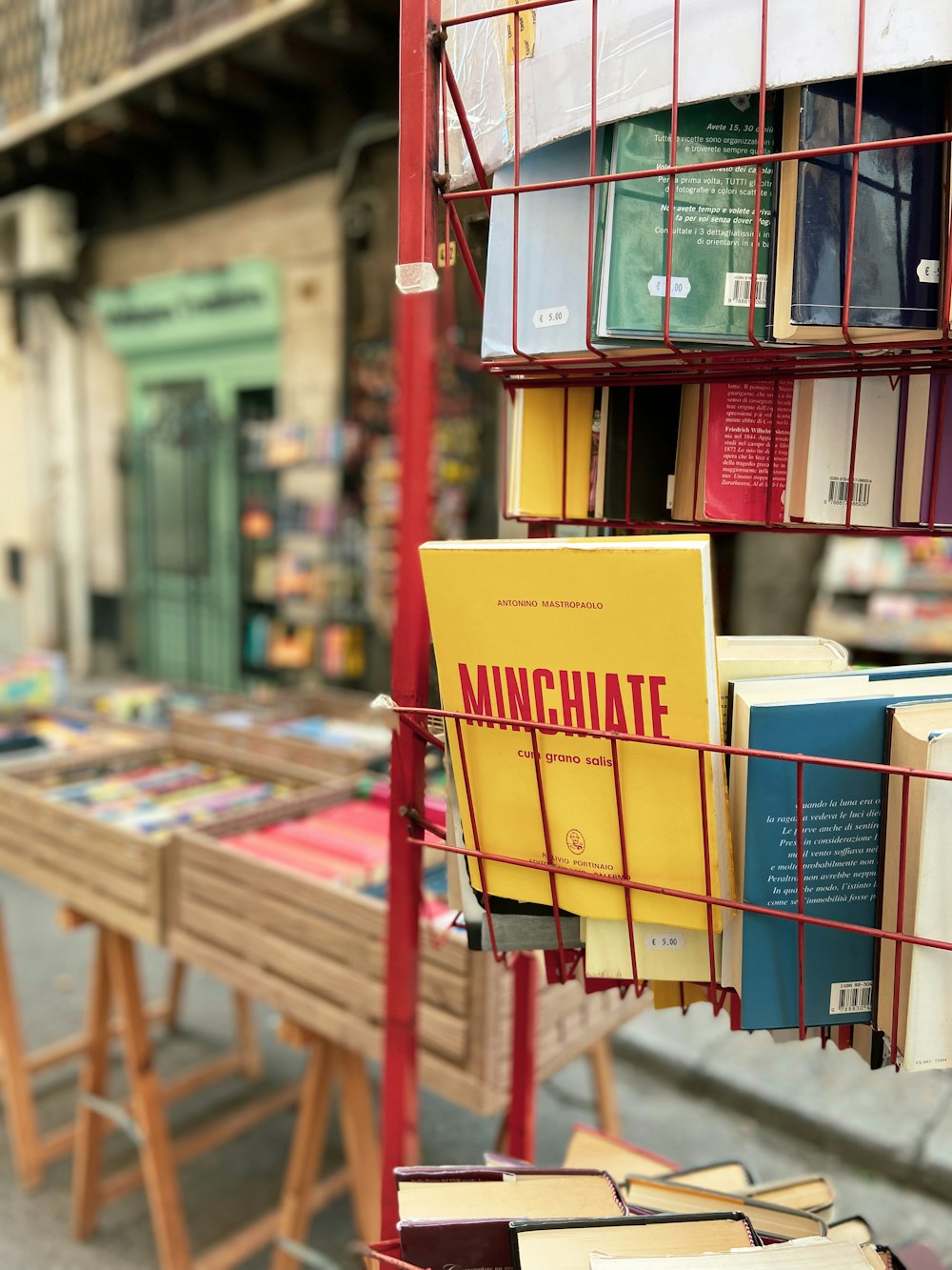 a bunch of books that are on a rack