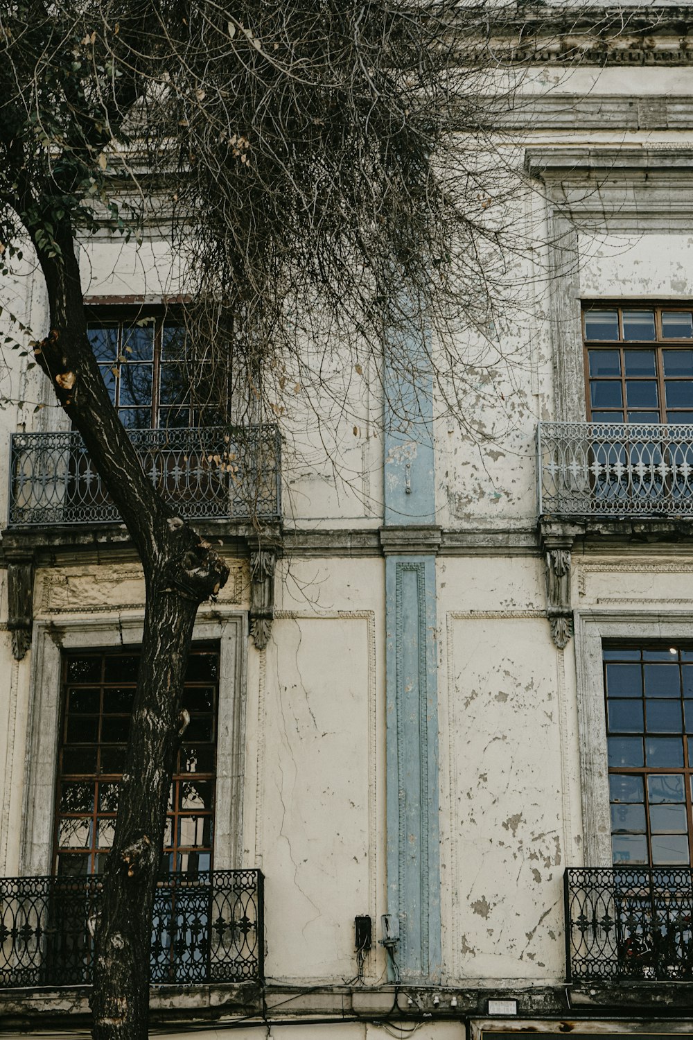 an old building with a clock on the front of it