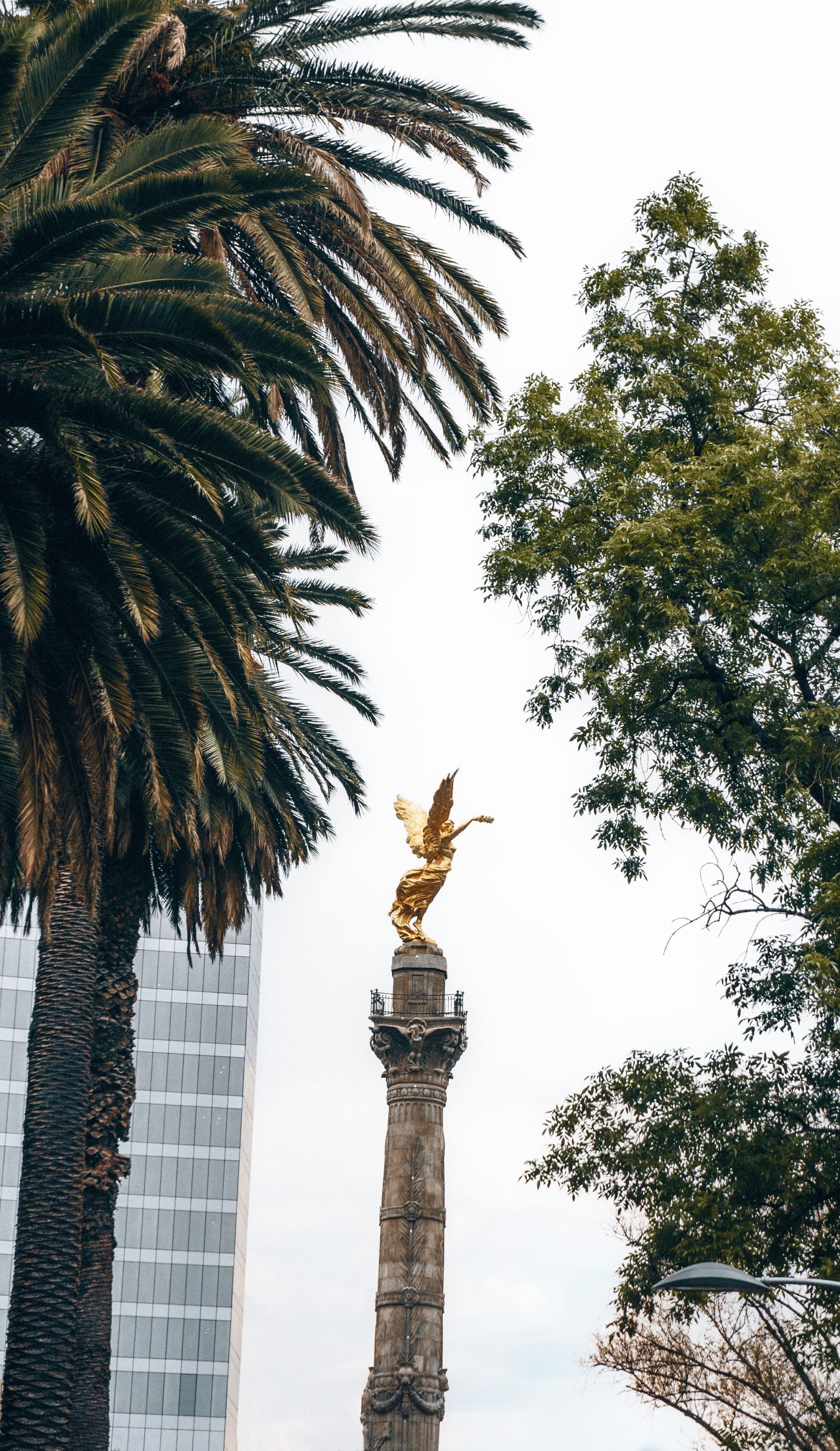 a statue with a bird on top of it