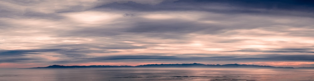 a sunset over a body of water