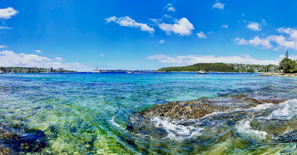 a body of water that has some rocks in it