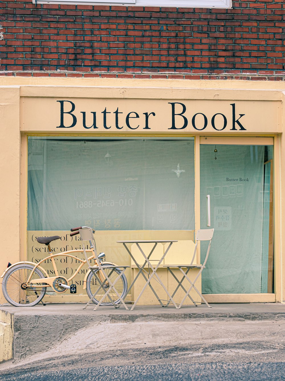 a bicycle parked in front of a butter book store