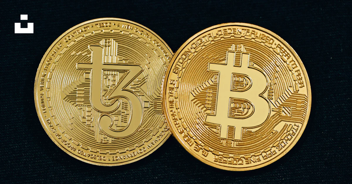 Two gold bitcoins sitting side by side on a black surface photo – Free ...